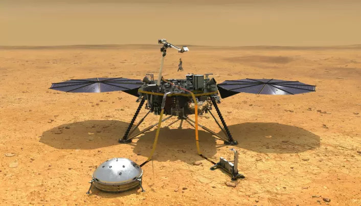 Her ser vi en illustrasjon av landeren InSight med solcellepaneler og to vitenskapelige instrumenter foran. Den runde bollen måler jordskjelv og kalles et seismometer.