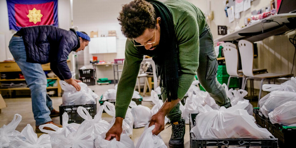 Kadir Kahar and Luis Santiago at the Salvation Army's 'slum station' in Oslo packed food bags for needy residents receiving home care services last year. The need is increasing.