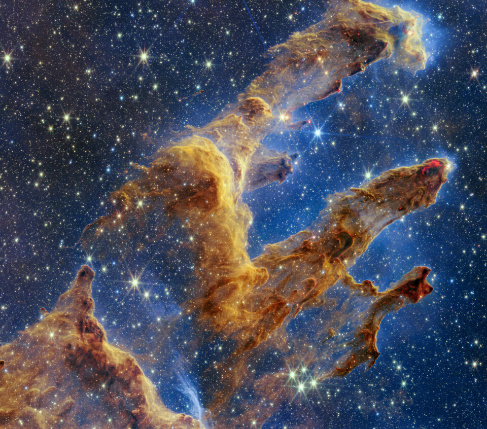 Dette bildet er tatt av en gass- og støvformasjon som blir kalt skapelsens søyler. Her blir unge stjerner skapt.