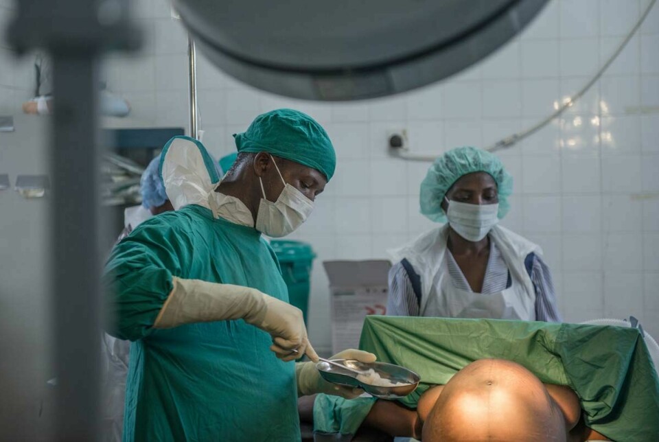 Ibrahim M. Sessay prepares to do an emergency c-section at Kenema Hospital in Sierra Leone.