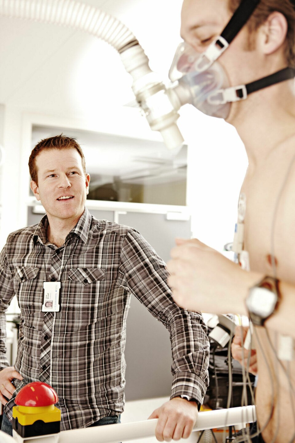Ulrik Wisløff, left, watches as a runner undergoes VO2max testing as part of his research on the health effects of exercise.