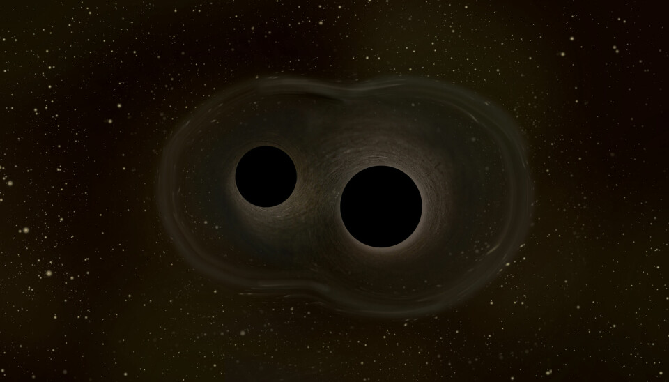 To sorte hull som er på vei til å smelte sammen.