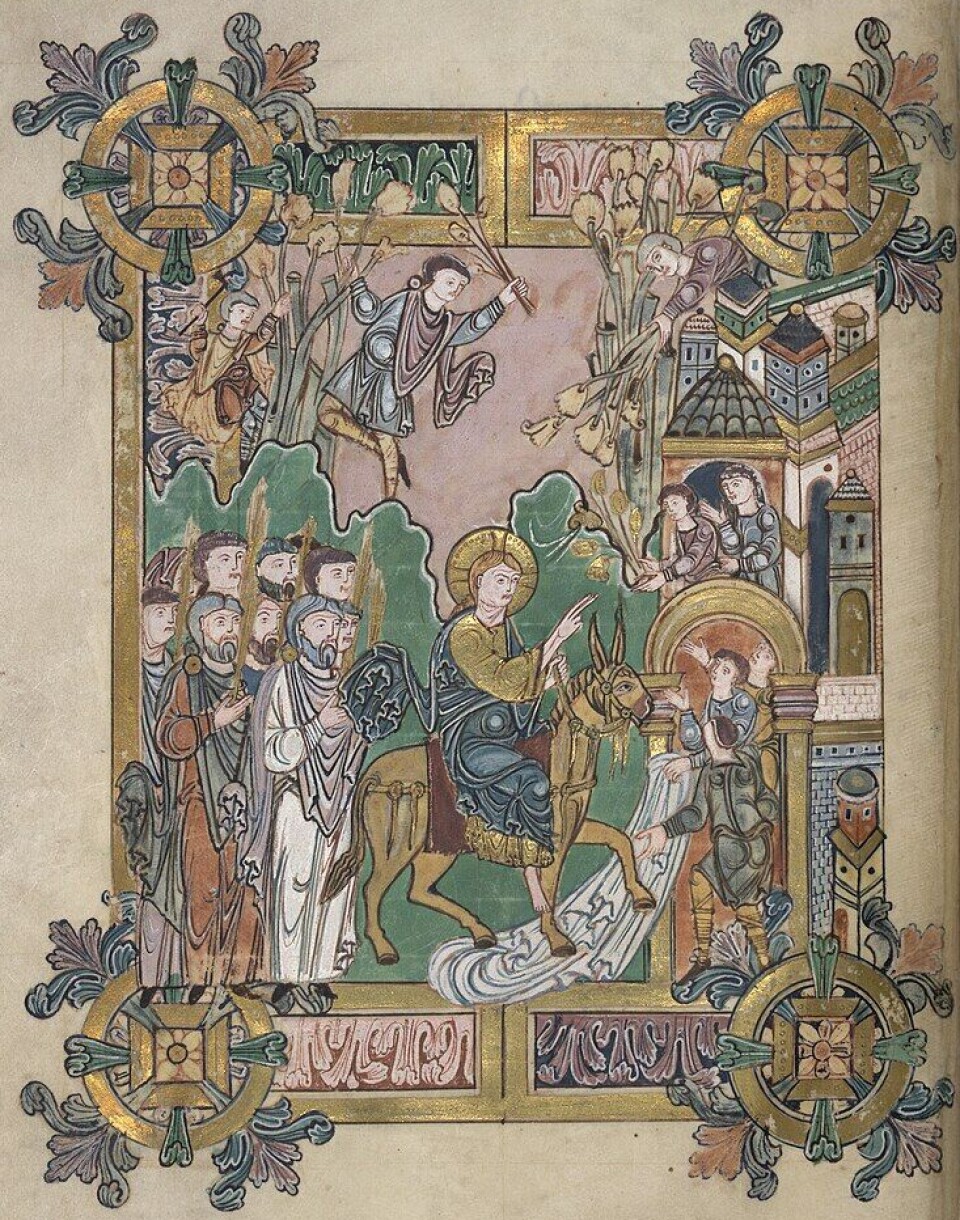 Rastløst bladverk rammer inn denne illustrasjonen av Jesu' inntog i Jerusalem palmesøndag, fra boken Æthelwolds benediksjonale.