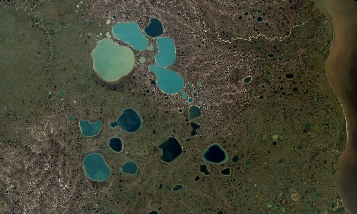 Dette er dødisgroper i Sibir. (Bilde: NASA) Dette er dødisgroper i Sibir. (Bilde: NASA)